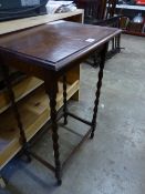 AN OAK BARLEY TWIST OCCASIONAL TABLE.