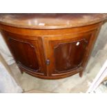 A 19TH CENTURY MAHOGANY BOW FRONT CORNER CABINET.