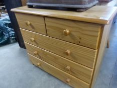 A MODERN PINE CHEST OF DRAWERS AND A SMALL BOOKCASE. (2)