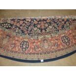 A CIRCULAR PERSIAN PATTERN CARPET