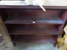 A SMALL OAK BOOKCASE.