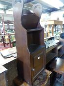 A SMALL OAK BOOKCASE.