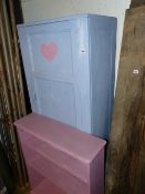 A CHILD'S PAINTED WARDROBE AND BOOKCASE