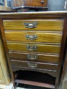 AN EDWARDIAN MAHOGANY MUSIC CABINET.