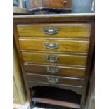 AN EDWARDIAN MAHOGANY MUSIC CABINET.