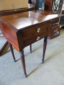 AN EARLY 19TH CENTURY DROP LEAF WORK TABLE.