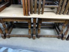 AN OAK AND ELM NEST OF COFFEE TABLES