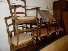 A SET OF EIGHT RUSH SEAT FRENCH LADDER BACK CHAIRS