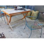 A TEAK GARDEN TABLE AND TWO WROUGHT IRON CHAIRS (3).