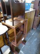 TWO RETRO TEAK NEST OF TABLES AN OAK MAGAZINE RACK. (3)