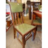 A SET OF SIX OAK ARTS AND CRAFTS OAK DINING CHAIRS.