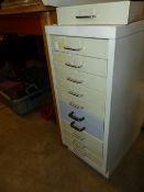 A MULTI DRAWER FILE CHEST CONTAINING NUTS BOLTS AND FIXINGS