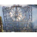 A PAIR OF WROUGHT IRON GATES