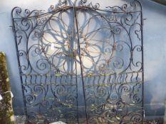 A PAIR OF WROUGHT IRON GATES