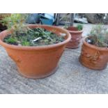 A PAIR OF SMALL TERRACOTTA PLANTERS AND ONE LARGE PLANTER (3).