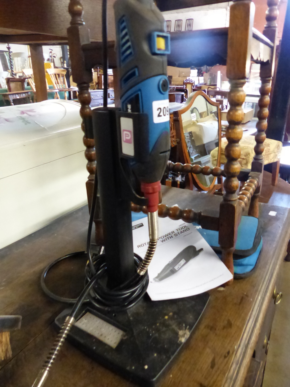 A ROTARY POWER TOOL WITH STAND.