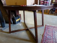 A MODERN HARDWOOD CENTRE TABLE.