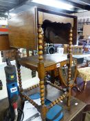 AN ANTIQUE OAK TWO TIER OCCASIONAL TABLE.