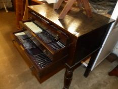 AN OAK TWO DRAWER CUTLERY CANTEEN AND CONTENTS