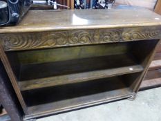 AN OAK OPEN BOOKCASE.