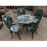 A SET OF FOUR CAST METAL PATIO CHAIRS AND A SIMILAR TABLE.