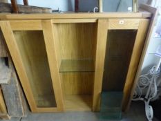 AN OAK DISPLAY CABINET