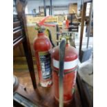 TWO FIRE EXTINGUISHERS.