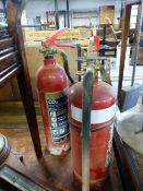 TWO FIRE EXTINGUISHERS.