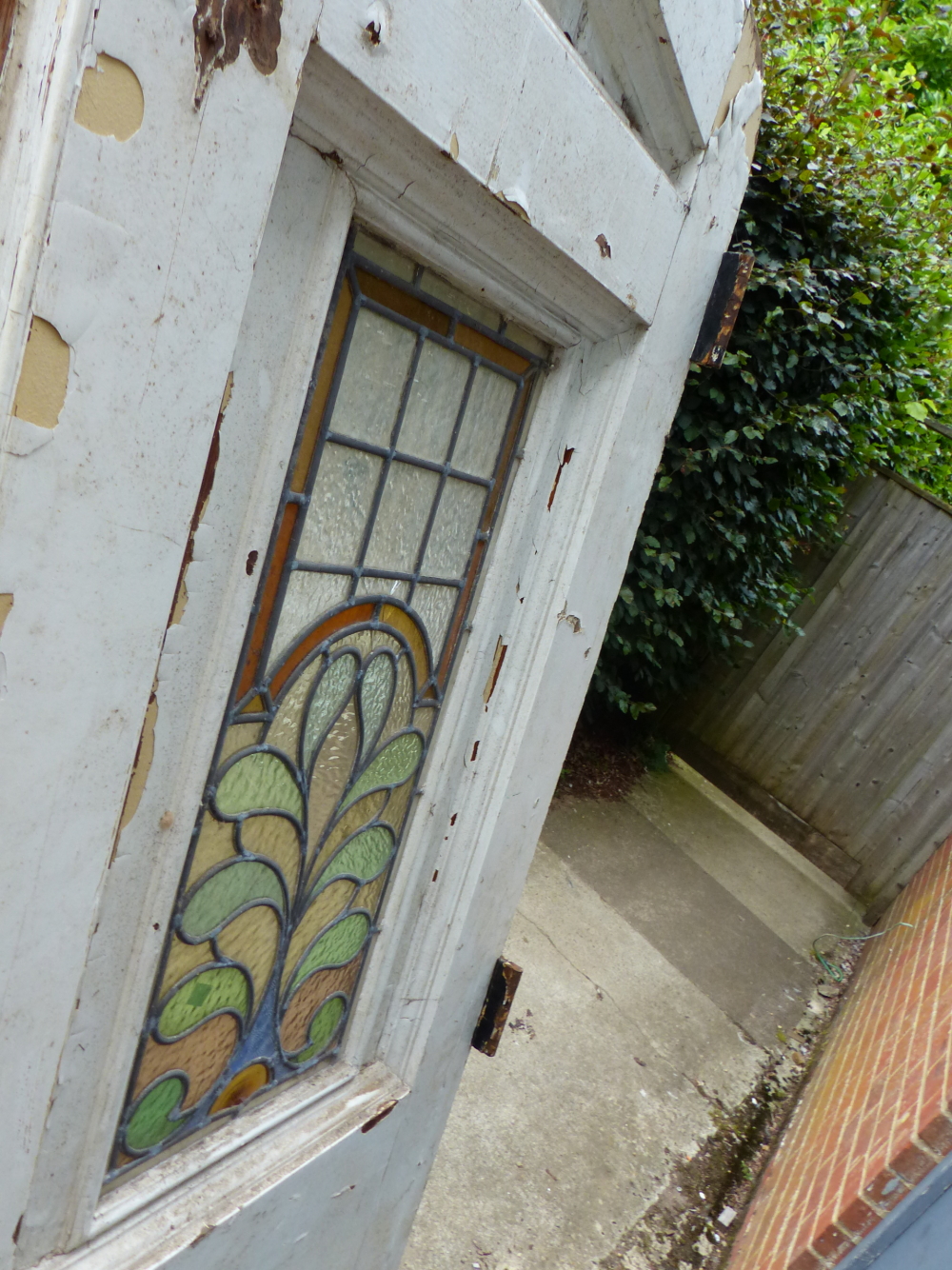 A PAIR OF GOTHIC OAK DOORS WITH FAUX STRAP HINGES AND STAINED GLASS PANELS COMPLETE WITH SURROUND. - Image 11 of 11