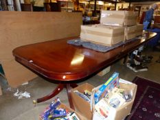 A LARGE GEORGIAN STYLE MAHOGANY TWIN PEDESTAL DINING TABLE