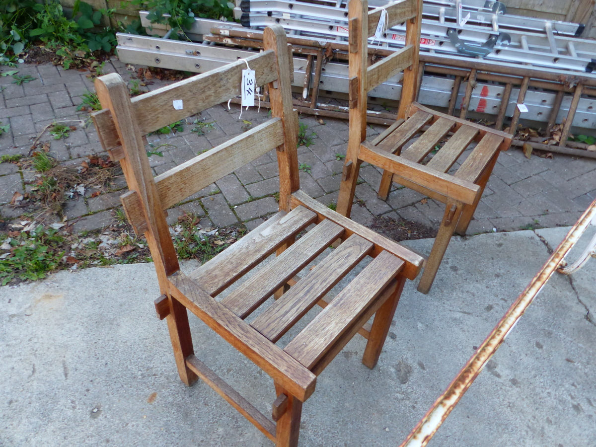 TWO TEAK GARDEN CHAIRS BY R.A. LISTER & CO. LTD