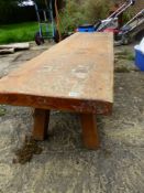 A LARGE PIG BENCH/COFFEE TABLE