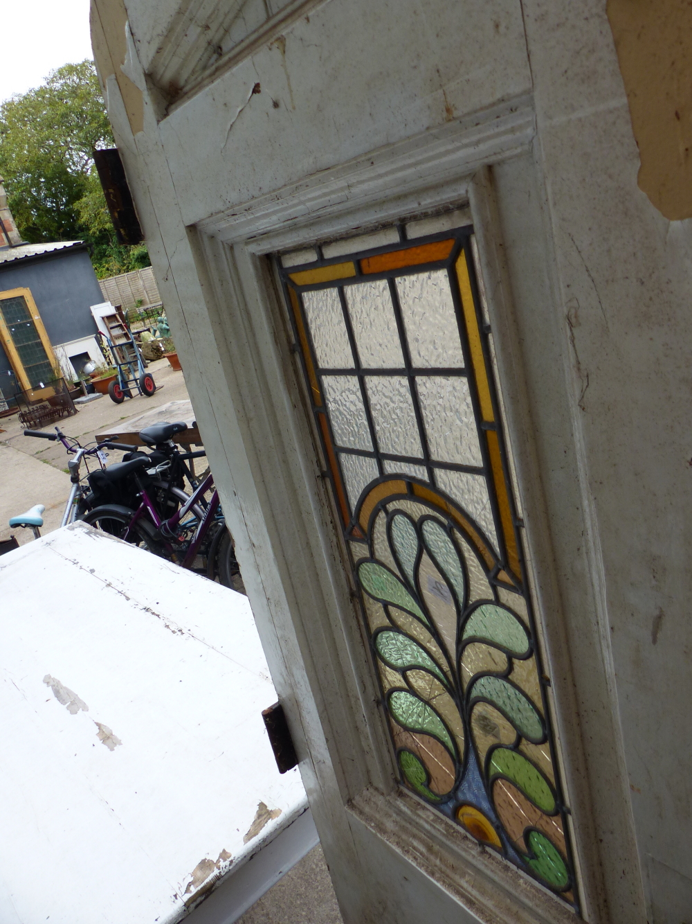 A PAIR OF GOTHIC OAK DOORS WITH FAUX STRAP HINGES AND STAINED GLASS PANELS COMPLETE WITH SURROUND. - Image 8 of 11