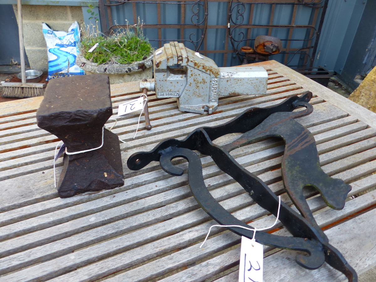 A SMALL HORNLESS ANVIL, A VICE AND A CAT HANGING BASKET BRACKET. (3)