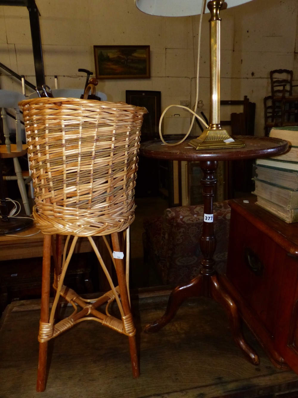 A WINE TABLE, A TABLE LAMP AND A RATTAN PLANT STAND