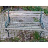 A WROUGHT IRON ENDED GARDEN BENCH