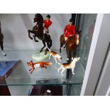 TWO BESWICK HUNTSMEN, TWO HOUNDS AND THE FOX