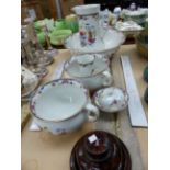 A FLORAL POTTERY JUG AND BOWL WASH SET TOGETHER WITH AN IGNEOUS STONE PLINTH