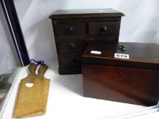 A MINIATURE CHEST OF THREE DRAWERS, A MAHOGANY TEA CADDY AND A PAIR OF BUTTER PATS