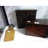 A MINIATURE CHEST OF THREE DRAWERS, A MAHOGANY TEA CADDY AND A PAIR OF BUTTER PATS