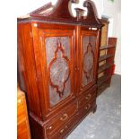 AN EDWARDIAN MAHOGANY DWARF LINEN PRESS WITH BREAK ARCH PEDIMENT