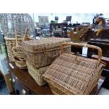 THREE WICKER PICNIC HAMPERS, A WICKER LOG BASKET ETC.