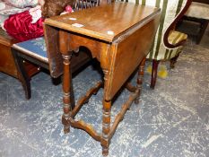 A SMALL DROP LEAF TABLE AND A BEDROOM CHAIR.