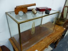A BRASS FRAMED GLAZED MODEL CAR DISPLAY CASE, TOGETHER WITH A MODEL CANNON, WINE ACCROUTREMENTS ETC.