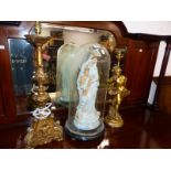 A PLASTER MADONNA AND CHILD UNDER A GLASS DOME TOGETHER WITH A GILT FIGURAL TABLE LAMP AND A BAROQUE