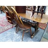 AN ERCOL DINING TABLE AND FOUR WINDSOR BACK STYLE CHAIRS W 152 X D 76 X H 72 CM