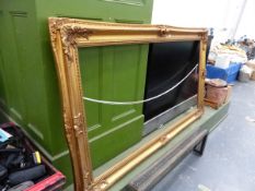 A LARGE GILT PICTURE FRAME.