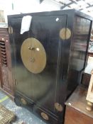 A LARGE EBONISED ORIENTAL TWO DOOR CABINET. W 92 X D 63 X H 145CMS.