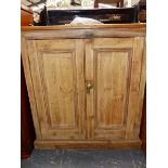 A VICTORIAN SMALL PINE SIDE CABINET WITH PANELLED DOORS. W 87 X D 39 X H 93CMS.