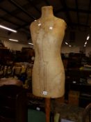 A VINTAGE DRESS MAKERS DUMMY.